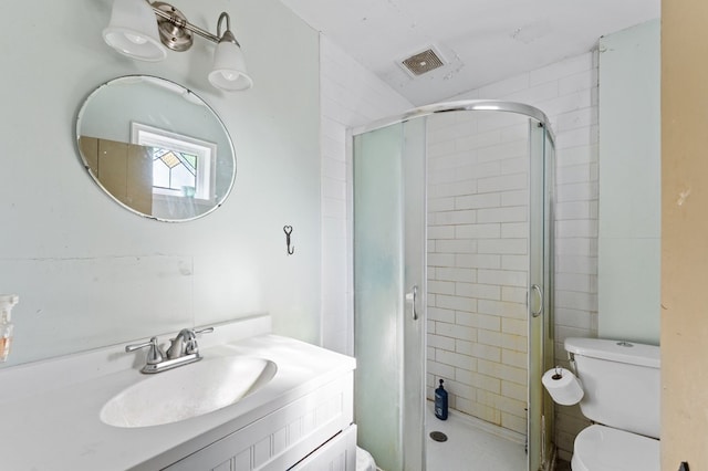 bathroom with a shower stall, visible vents, toilet, and vanity