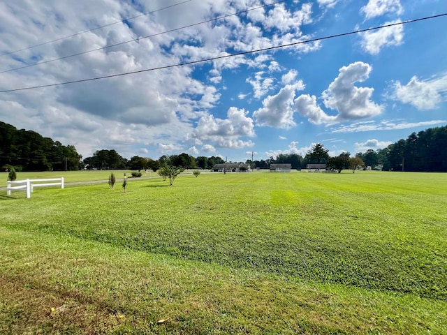 view of yard with a rural view