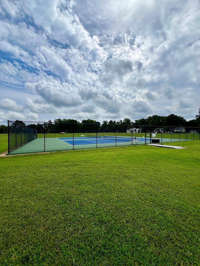 view of home's community featuring a yard