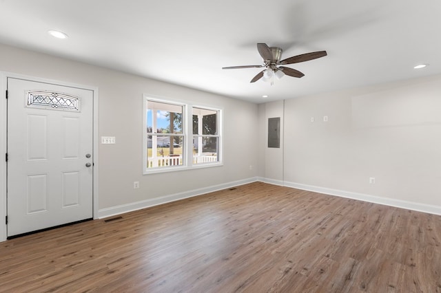 foyer featuring electric panel, ceiling fan, and wood-type flooring