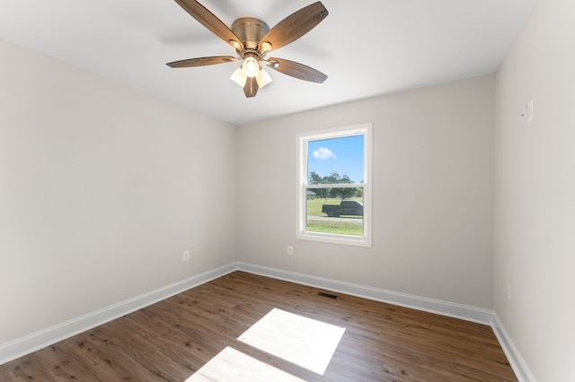 spare room with ceiling fan and hardwood / wood-style flooring