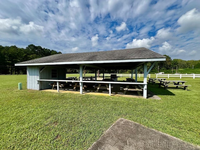 view of property's community with a gazebo and a yard