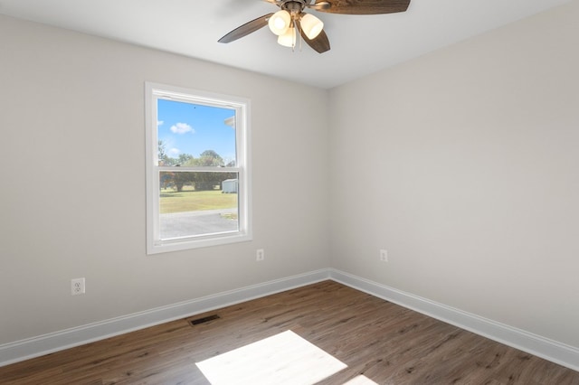 empty room with ceiling fan and wood-type flooring