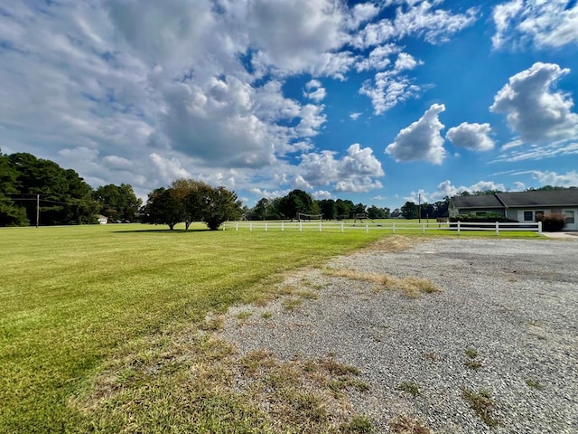 view of yard with a rural view