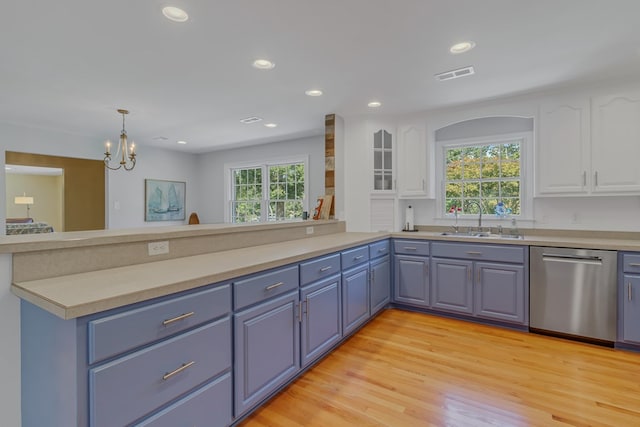 kitchen featuring a chandelier, white cabinetry, sink, and stainless steel dishwasher