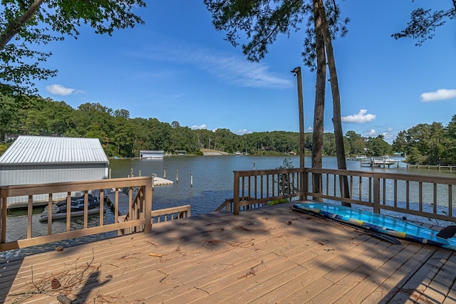 view of dock featuring a deck with water view