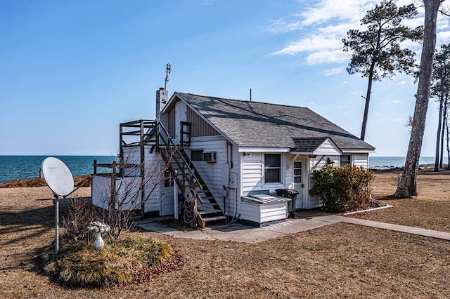 exterior space with a water view