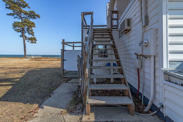 staircase with a water view