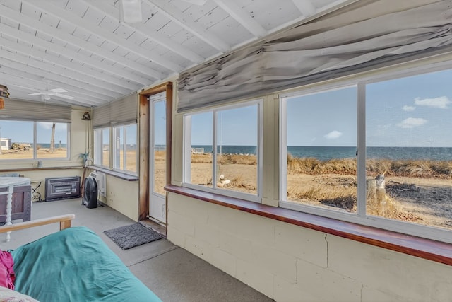 sunroom / solarium featuring a water view, ceiling fan, and lofted ceiling