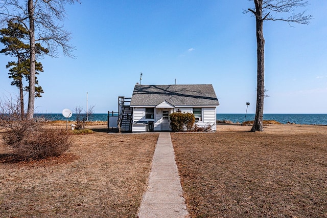 view of front of property with a water view