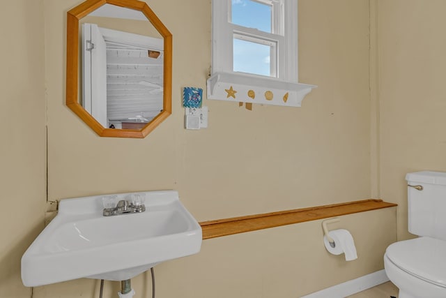 bathroom with sink and toilet