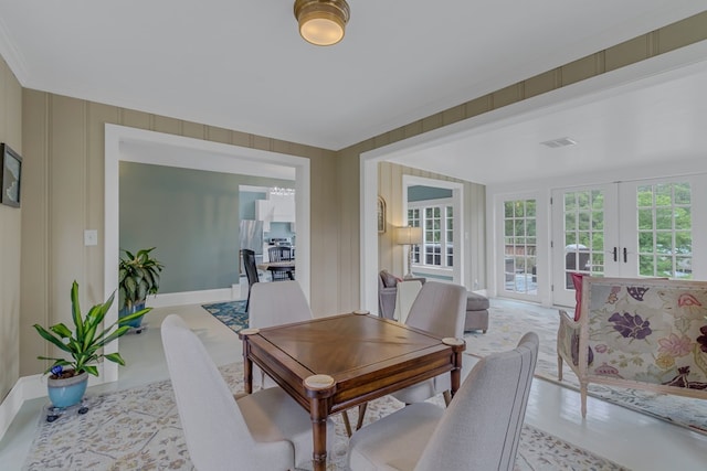 dining room featuring french doors and ornamental molding