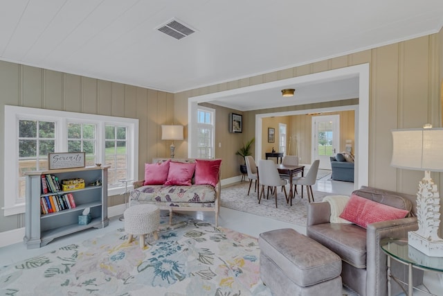 living room with ornamental molding