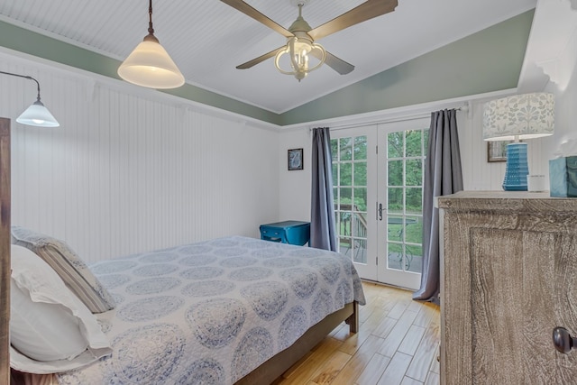 bedroom featuring access to outside, french doors, vaulted ceiling, light hardwood / wood-style flooring, and ceiling fan