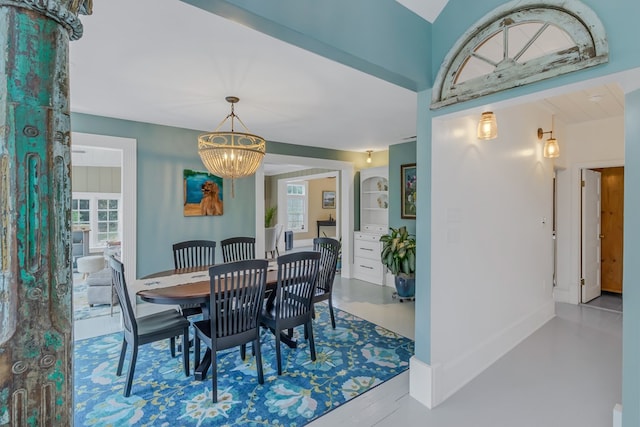 dining space with a chandelier