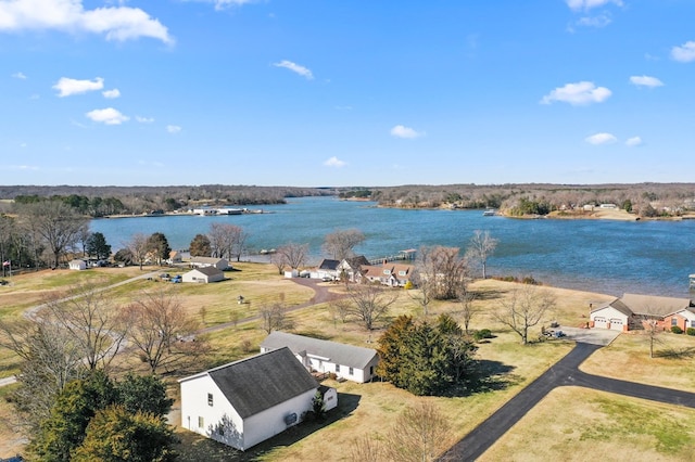 drone / aerial view with a residential view and a water view