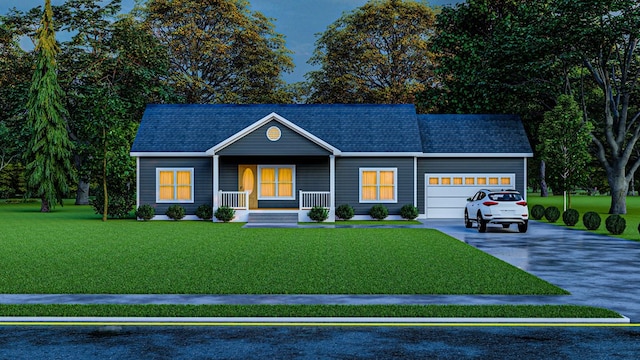 view of front of home featuring covered porch, a garage, and a front lawn