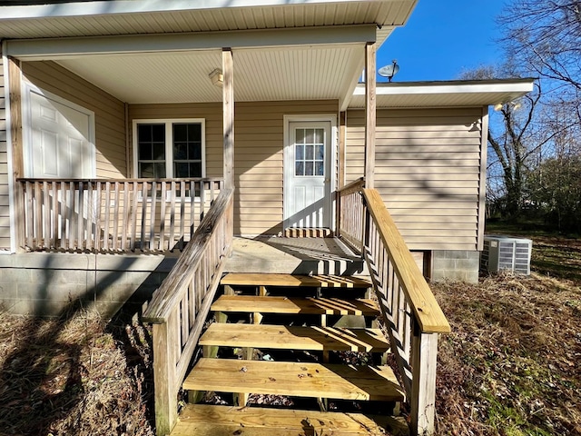 entrance to property featuring central AC