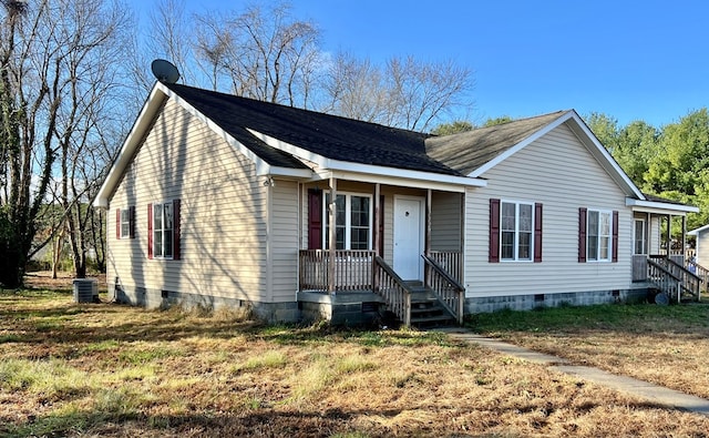 view of front facade with a front lawn and cooling unit