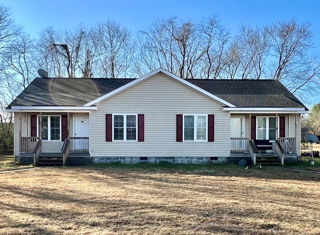 view of front of property featuring covered porch and a front yard