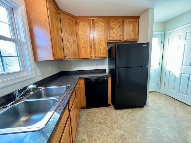 kitchen featuring sink and black appliances