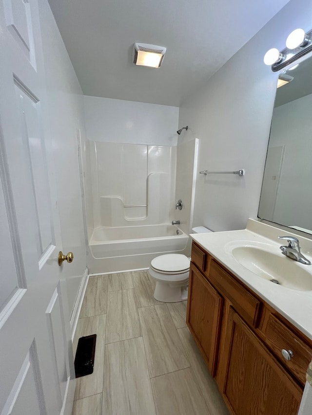 full bathroom with vanity, shower / bath combination, and toilet