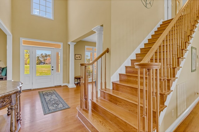 601 Cranes Creek Harbor Dr, Heathsville, VA 22473 - foyer entrance with a high ceiling, ornate columns, wood finished floors, stairs, and baseboards