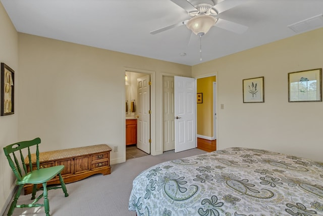 601 Cranes Creek Harbor Dr, Heathsville, VA 22473 - bedroom featuring carpet, baseboards, ceiling fan, and connected bathroom