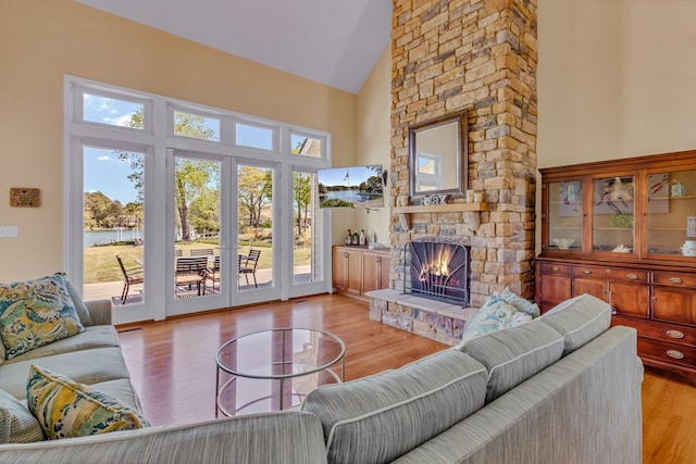 601 Cranes Creek Harbor Dr, Heathsville, VA 22473 - living room with a fireplace, healthy amount of natural light, high vaulted ceiling, and wood finished floors