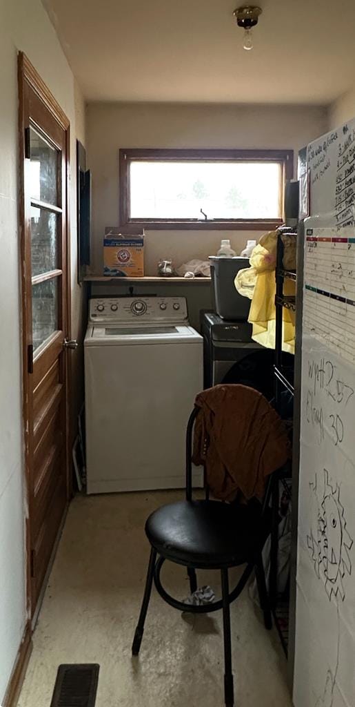 washroom featuring washer and dryer and visible vents