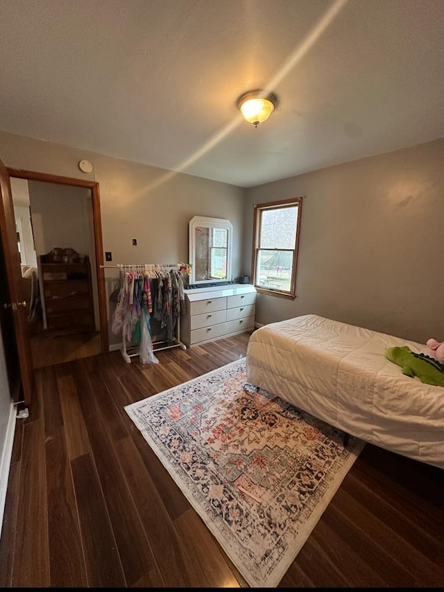 bedroom featuring wood finished floors