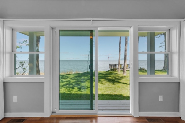 entryway featuring a water view and plenty of natural light