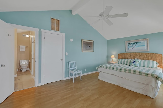 bedroom featuring ceiling fan, beam ceiling, high vaulted ceiling, ensuite bathroom, and light wood-type flooring