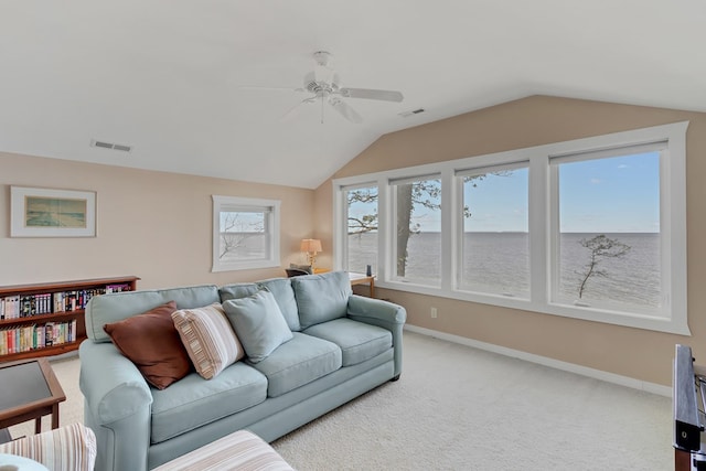 living room with lofted ceiling, light colored carpet, and ceiling fan