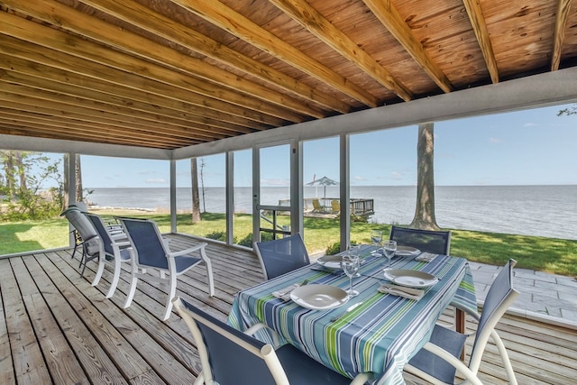 wooden terrace featuring a water view