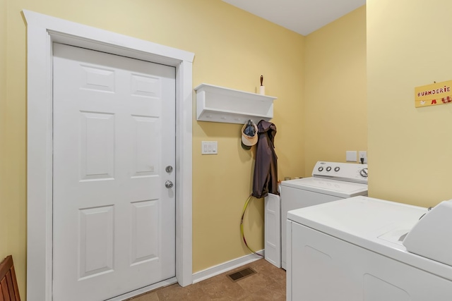 washroom with washing machine and dryer