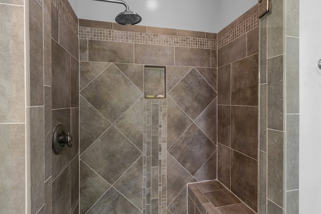 bathroom featuring tiled shower