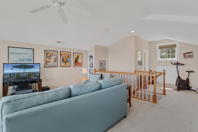 living room with vaulted ceiling and light colored carpet