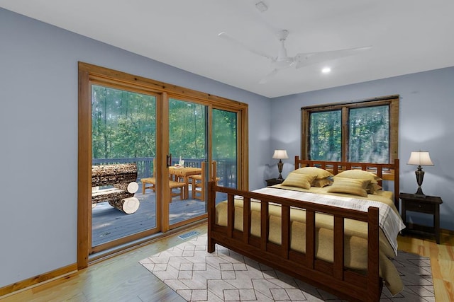 bedroom featuring ceiling fan, access to exterior, and light hardwood / wood-style flooring