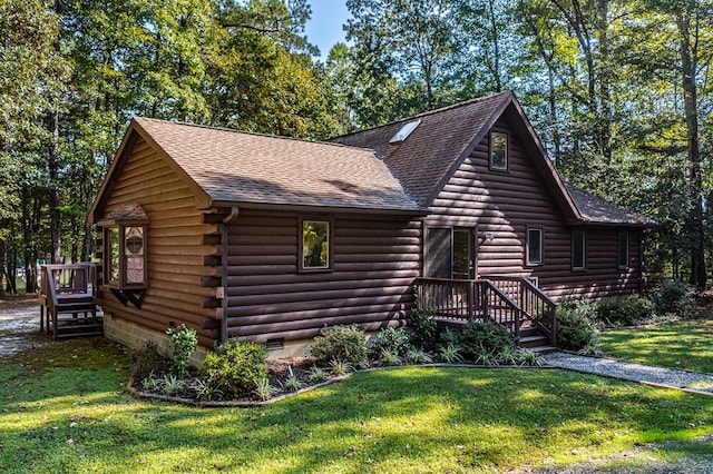 cabin with a front lawn