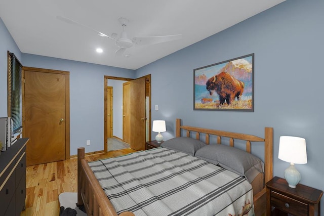 bedroom with light wood-type flooring and ceiling fan