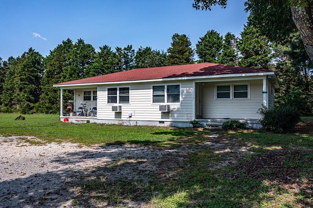 view of front facade with a front yard and cooling unit