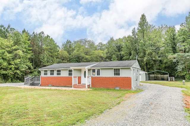 single story home with a carport and a front lawn