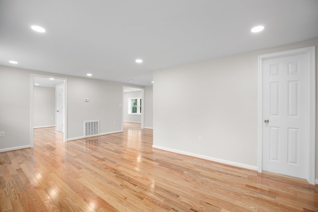 unfurnished room with light wood-type flooring