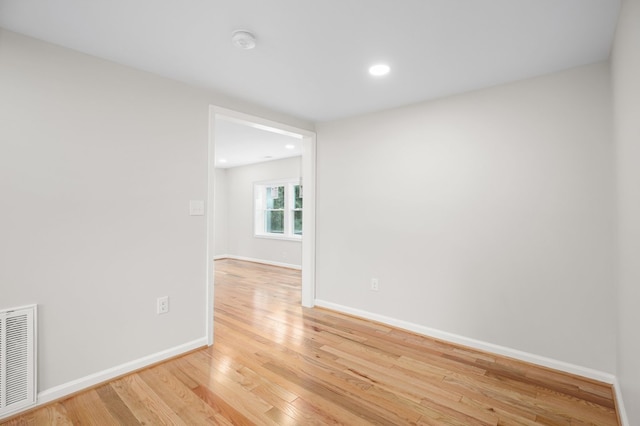 spare room with light hardwood / wood-style flooring