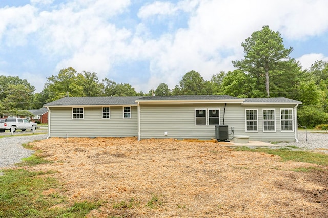 back of property featuring central air condition unit and a patio area