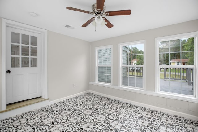 spare room featuring ceiling fan