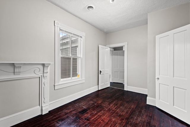 46 Yeocomico Ln, Kinsale, VA 22488 - unfurnished bedroom featuring wood-type flooring, a textured ceiling, and baseboards