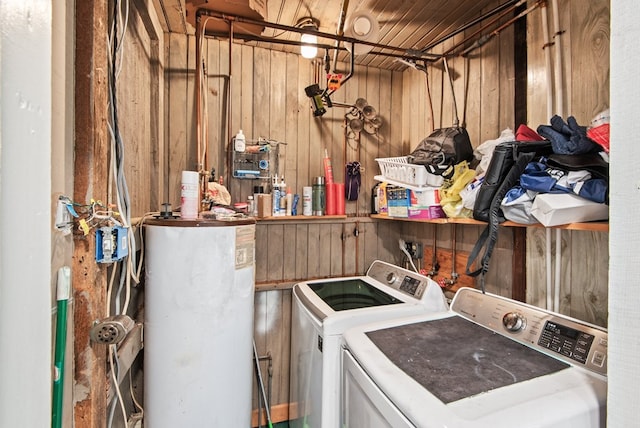 46 Yeocomico Ln, Kinsale, VA 22488 - laundry room with gas water heater, separate washer and dryer, and wooden walls