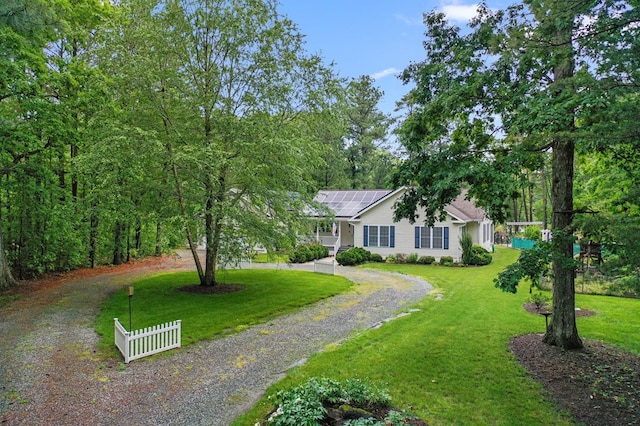 586 Kingscote Dr, Lottsburg, VA 22511 - view of front of home with dirt driveway and solar panels